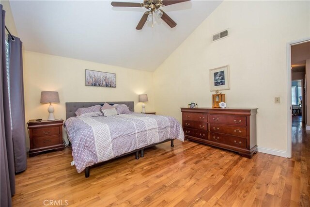 3251 Mountainside Dr, Corona, CA 92882 - bedroom featuring wood finished floors, high vaulted ceiling, a ceiling fan, and baseboards