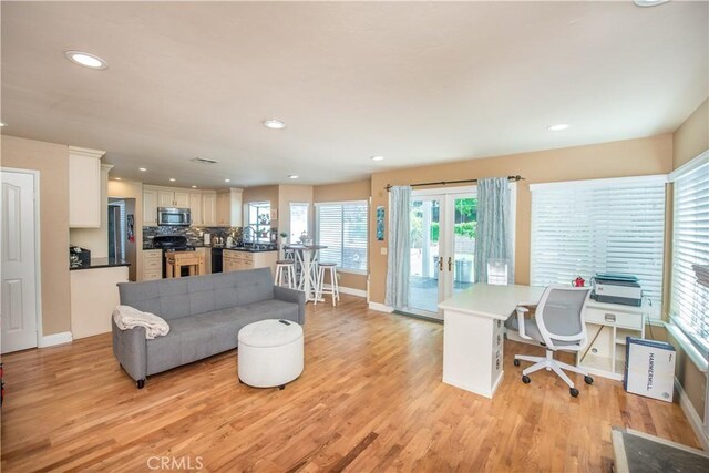 3251 Mountainside Dr, Corona, CA 92882 - living room with french doors, light wood-style flooring, baseboards, recessed lighting, and a desk
