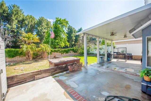 3251 Mountainside Dr, Corona, CA 92882 - view of patio featuring ceiling fan and a garden