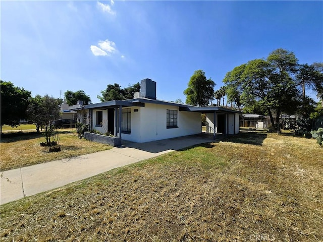 single story home featuring driveway and stucco siding