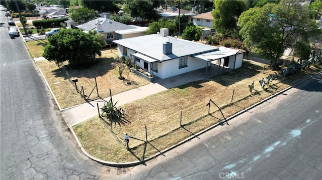 birds eye view of property with a residential view