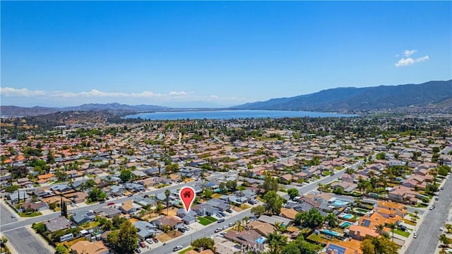 aerial view featuring a residential view and a water and mountain view