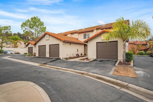 5704 Camino Del Cielo Unit 502, Bonsall, CA 92003 - view of front of property with a tiled roof and stucco siding