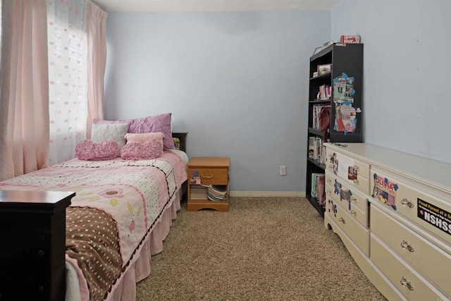 carpeted bedroom with baseboards