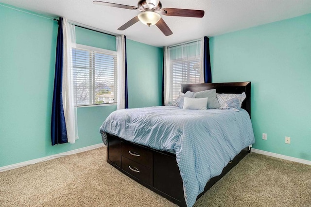 bedroom featuring carpet flooring, baseboards, and a ceiling fan