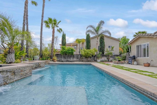 view of swimming pool with a fenced backyard, a patio, a fenced in pool, and a grill