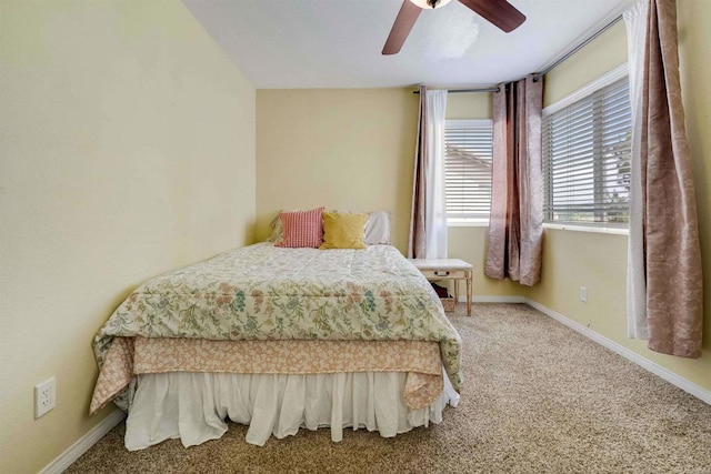 bedroom with carpet flooring, baseboards, and ceiling fan