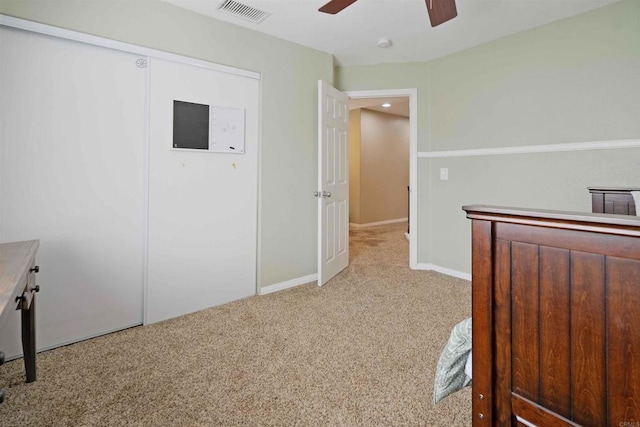 unfurnished bedroom with visible vents, baseboards, ceiling fan, and carpet floors