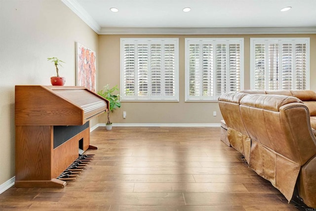 sitting room featuring ornamental molding, baseboards, hardwood / wood-style floors, and recessed lighting