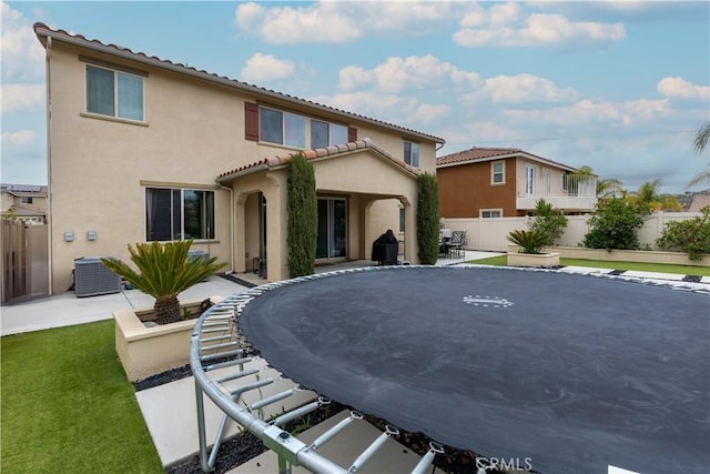 36696 Pavic Ct, Lake Elsinore, CA 92532 - rear view of property featuring a patio, stucco siding, a trampoline, and a tiled roof
