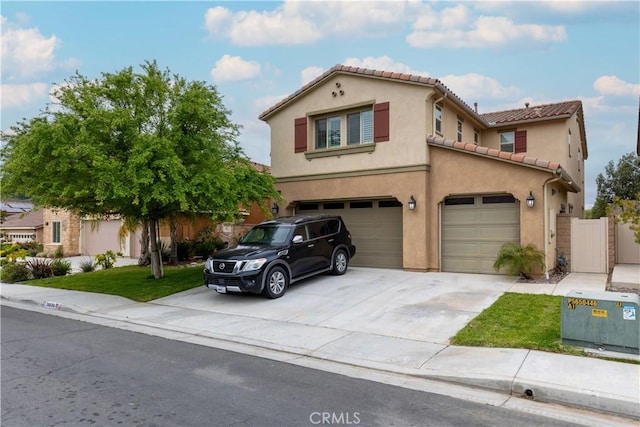 36696 Pavic Ct, Lake Elsinore, CA 92532 - view of front of house featuring a garage, concrete driveway, stucco siding, and a tiled roof