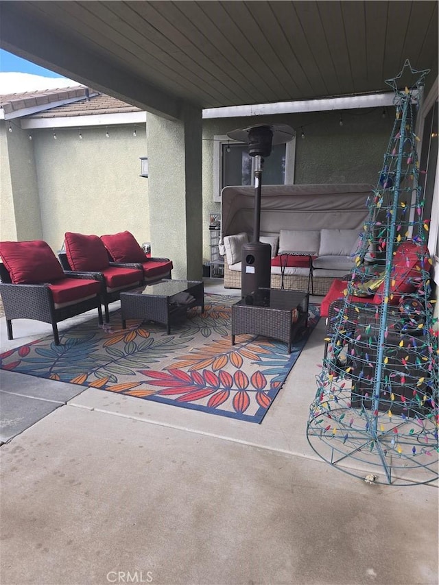 4990 Padre Ave, Rancho Cucamonga, CA 91739 - view of patio / terrace featuring a covered hot tub and an outdoor living space