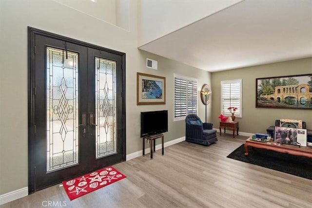 4990 Padre Ave, Rancho Cucamonga, CA 91739 - foyer entrance featuring baseboards, french doors, visible vents, and wood finished floors