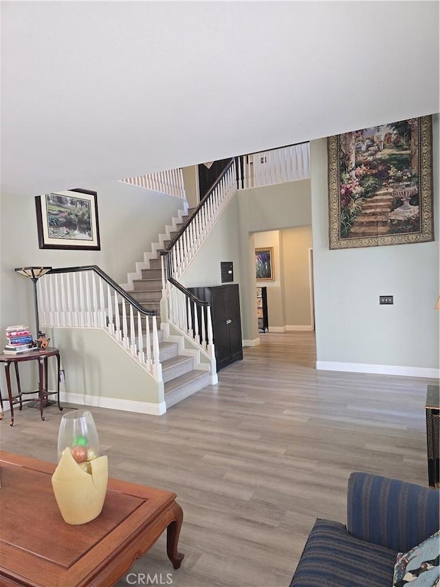 4990 Padre Ave, Rancho Cucamonga, CA 91739 - living area with baseboards, stairs, and wood finished floors