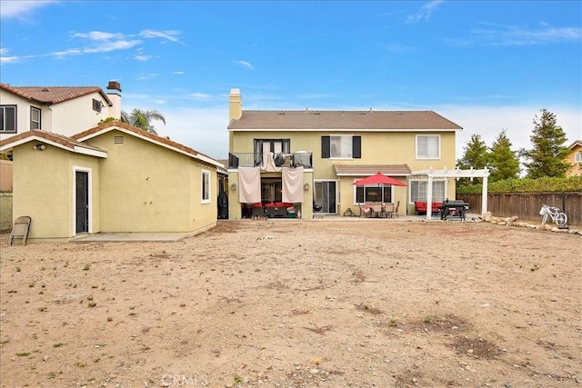 4990 Padre Ave, Rancho Cucamonga, CA 91739 - back of property featuring a balcony, a patio, stucco siding, a pergola, and a fenced backyard