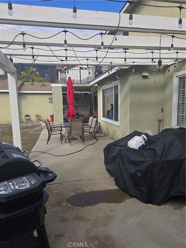 4990 Padre Ave, Rancho Cucamonga, CA 91739 - view of patio / terrace with a pergola, outdoor dining area, and a balcony