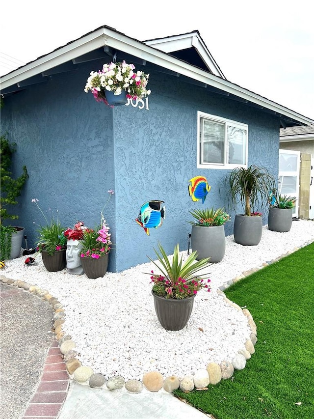 6051 Summerdale Dr, Huntington Beach, CA 92647 - view of side of home featuring stucco siding