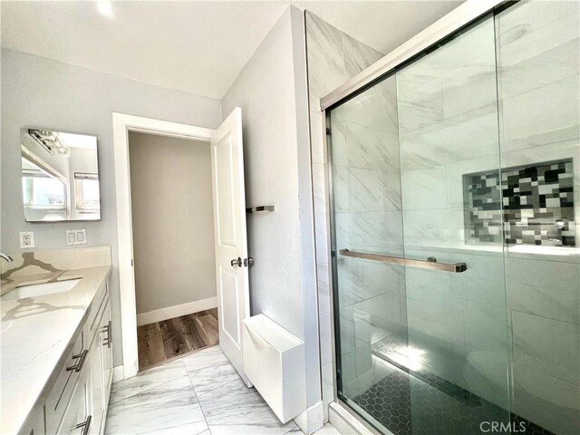 6051 Summerdale Dr, Huntington Beach, CA 92647 - full bath with a stall shower, marble finish floor, baseboards, and vanity