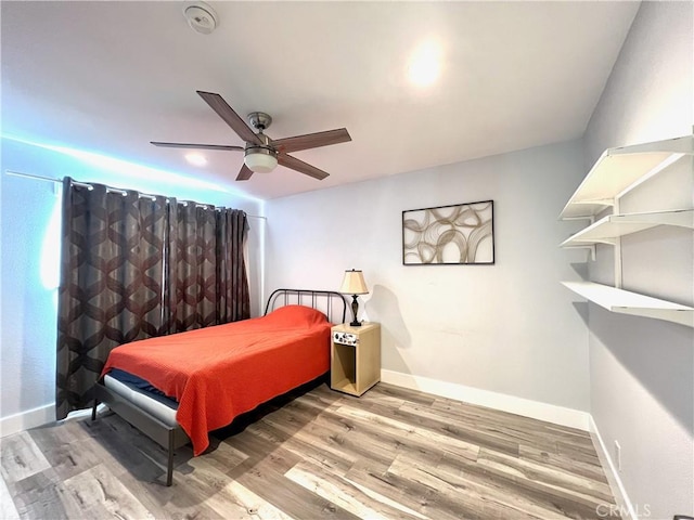 6051 Summerdale Dr, Huntington Beach, CA 92647 - bedroom with baseboards, a ceiling fan, and wood finished floors