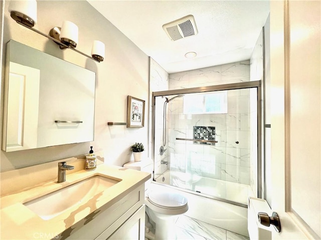 6051 Summerdale Dr, Huntington Beach, CA 92647 - bathroom with bath / shower combo with glass door, marble finish floor, toilet, visible vents, and vanity