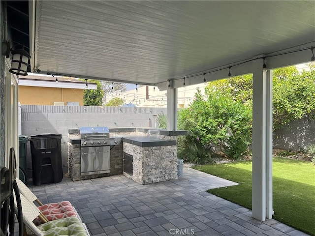 6051 Summerdale Dr, Huntington Beach, CA 92647 - view of patio featuring area for grilling and a fenced backyard