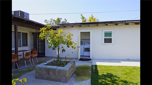 3206 Candlewood Dr, Bakersfield, CA 93306 - rear view of house with a patio, stucco siding, and washer / dryer