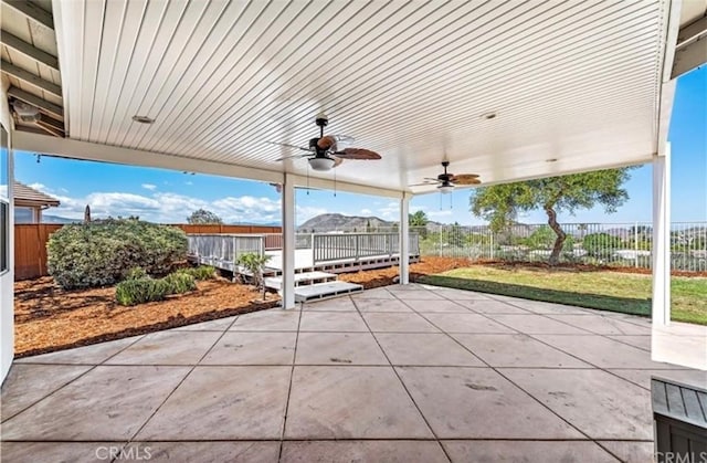 view of patio featuring ceiling fan and a fenced backyard