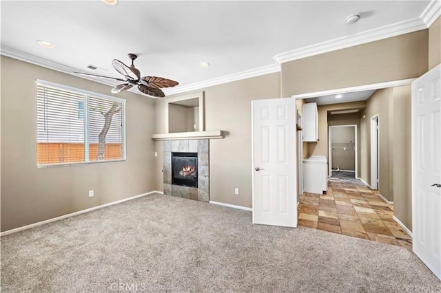 unfurnished living room with light colored carpet, crown molding, and ceiling fan