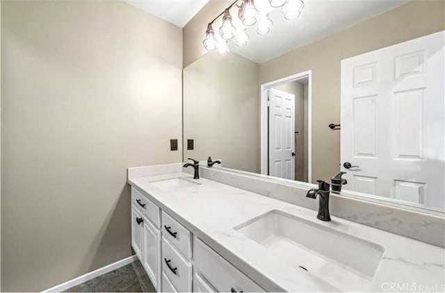 33908 Applecart Ct, Wildomar, CA 92595 - bathroom with double vanity and baseboards