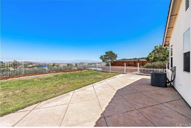view of patio / terrace featuring central AC unit and a fenced backyard