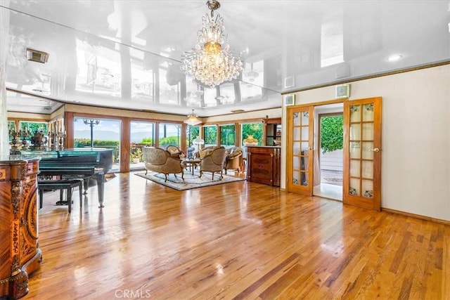 17861 Cathedral Pl, Encino, CA 91316 - living area featuring french doors, wood finished floors, and a chandelier