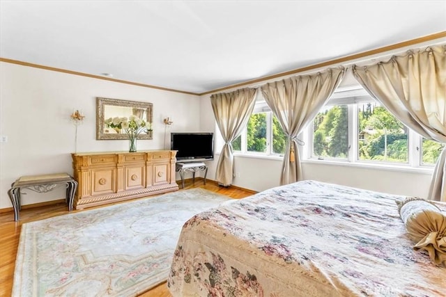 17861 Cathedral Pl, Encino, CA 91316 - bedroom with light wood-style floors and ornamental molding