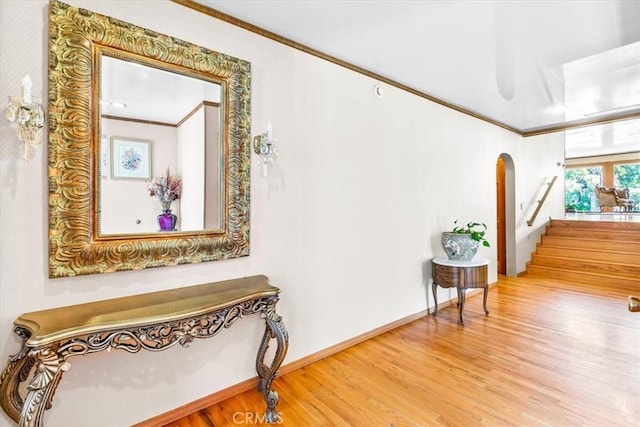 17861 Cathedral Pl, Encino, CA 91316 - hall featuring arched walkways, wood finished floors, stairs, and crown molding
