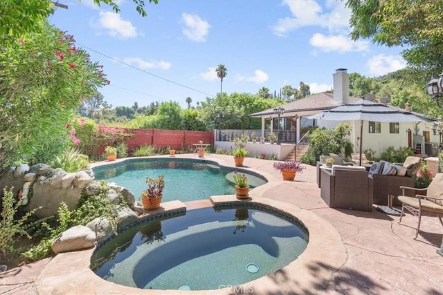 17861 Cathedral Pl, Encino, CA 91316 - view of swimming pool with a fenced backyard, a patio, a pool with connected hot tub, and an outdoor hangout area