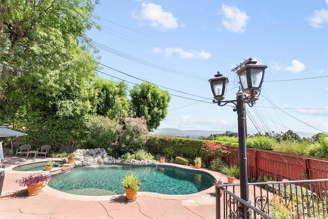 17861 Cathedral Pl, Encino, CA 91316 - view of swimming pool with a patio area and a pool with connected hot tub