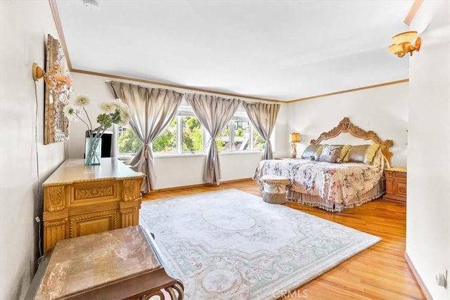 17861 Cathedral Pl, Encino, CA 91316 - bedroom with light wood finished floors and ornamental molding