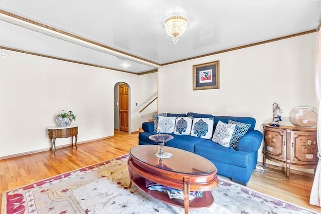 17861 Cathedral Pl, Encino, CA 91316 - living room with arched walkways, wood finished floors, and crown molding