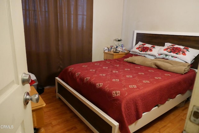 bedroom with wood finished floors
