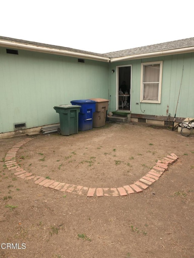 rear view of house with visible vents