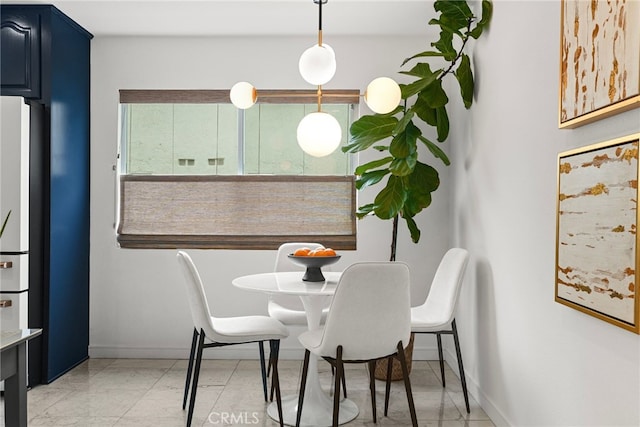 dining room featuring baseboards