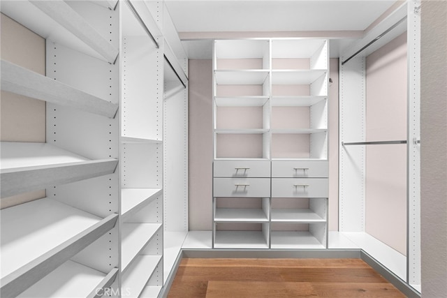 spacious closet with wood finished floors