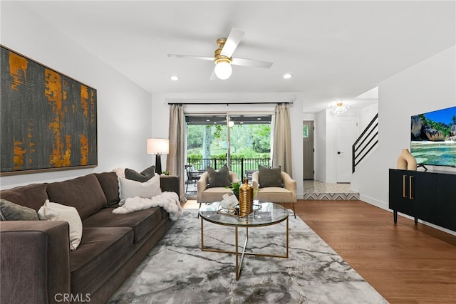 living area featuring stairway, ceiling fan, recessed lighting, and wood finished floors