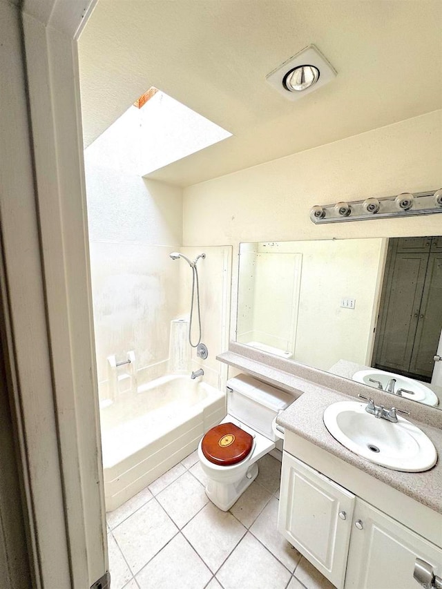 full bath with tile patterned flooring, shower / washtub combination, toilet, vanity, and a skylight