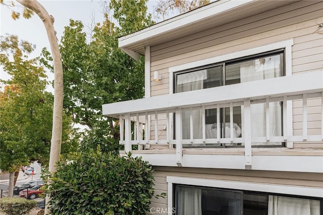 back of property with a balcony
