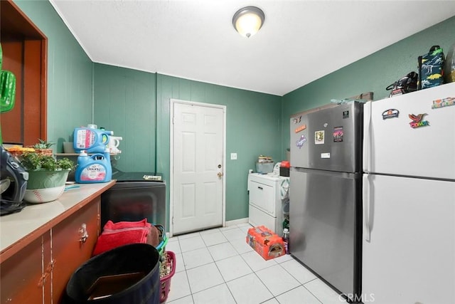 423 Landsford St, Lancaster, CA 93535 - kitchen featuring freestanding refrigerator, light countertops, washer / clothes dryer, and light tile patterned flooring