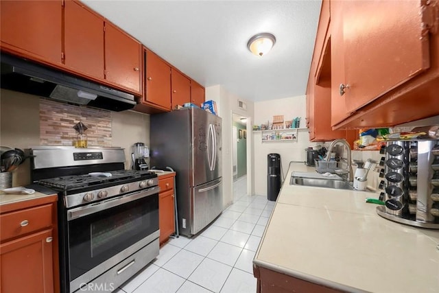 423 Landsford St, Lancaster, CA 93535 - kitchen featuring light tile patterned floors, a sink, stainless steel appliances, under cabinet range hood, and light countertops