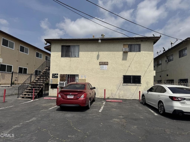 uncovered parking lot featuring stairs