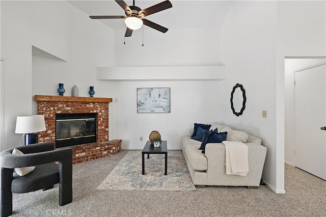 624 Rensselaer Ct, Merced, CA 95348 - carpeted living area with baseboards, a fireplace, ceiling fan, and a towering ceiling