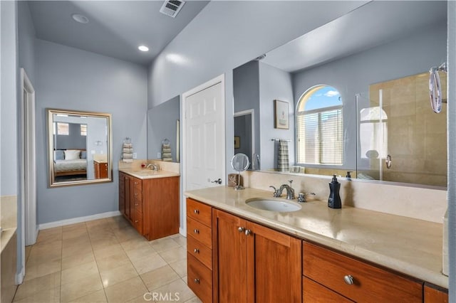 12931 Runway Rd, Playa Vista, CA 90094 - bathroom with two vanities, tile patterned flooring, tiled shower, and baseboards