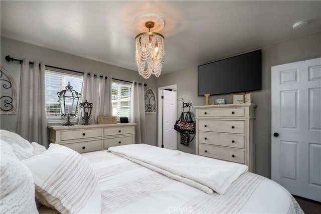 bedroom with a chandelier